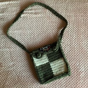 Green/white knitted crossover bag. Written “Baguio city” on top.